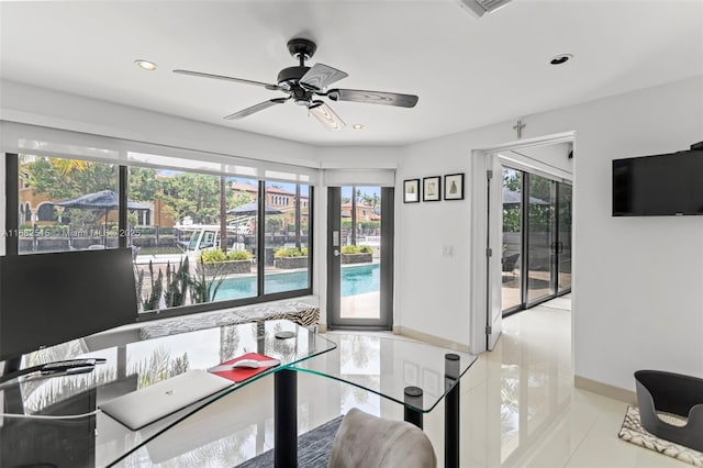 home office with ceiling fan and light tile patterned floors