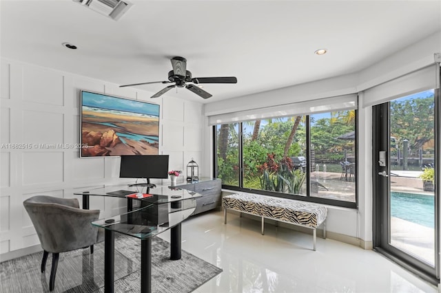 home office with ceiling fan and light tile patterned floors