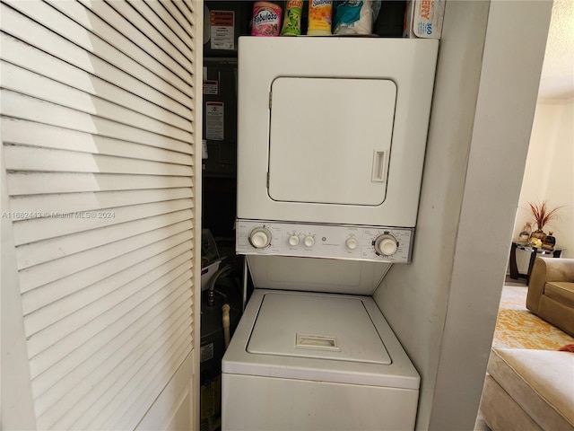 washroom with stacked washer / drying machine