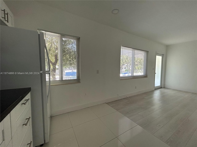 unfurnished room with light hardwood / wood-style flooring