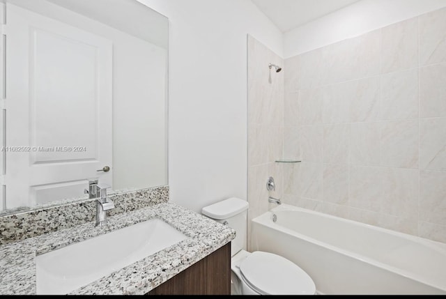 full bathroom featuring vanity, toilet, and tiled shower / bath