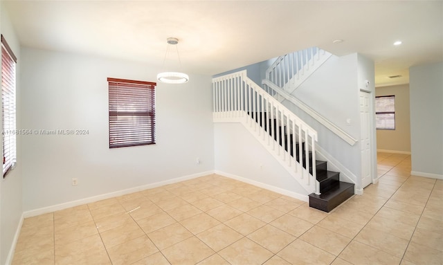 stairs featuring tile patterned floors