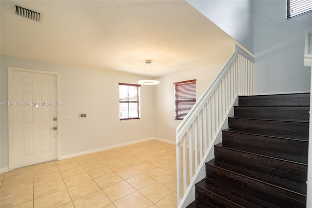 foyer entrance with light tile patterned floors