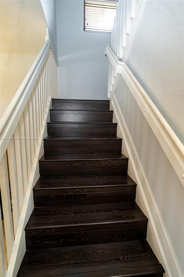 stairway featuring hardwood / wood-style floors