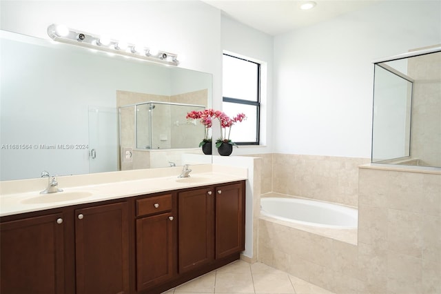 bathroom featuring vanity, tile patterned floors, and separate shower and tub