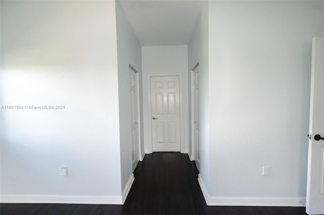 corridor featuring dark hardwood / wood-style floors