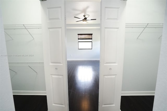 spacious closet with hardwood / wood-style floors and ceiling fan