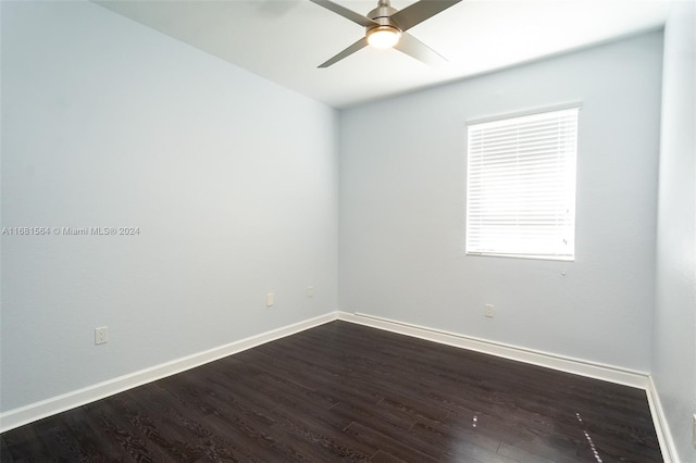 spare room featuring ceiling fan and dark hardwood / wood-style flooring