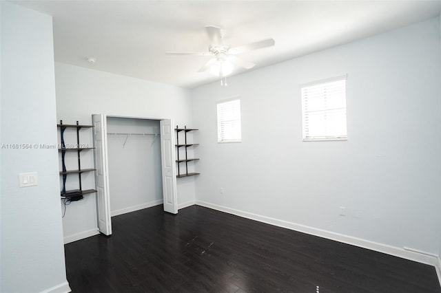 unfurnished bedroom with a closet, ceiling fan, and dark hardwood / wood-style floors