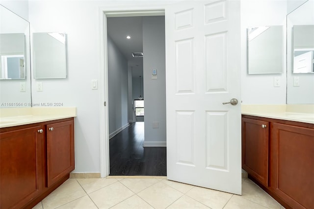 bathroom featuring vanity and wood-type flooring