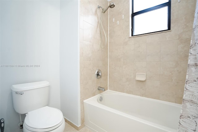 bathroom featuring toilet, shower / bath combo, and tile patterned floors