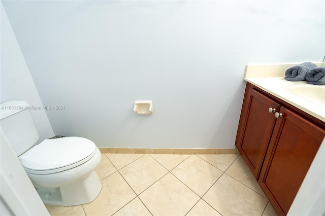 bathroom featuring vanity, toilet, and tile patterned floors