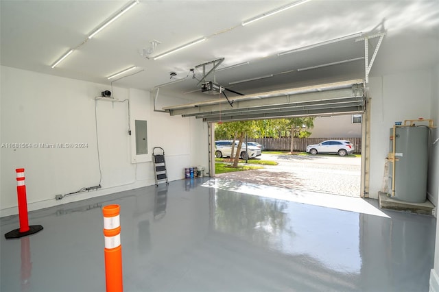 garage with a garage door opener, electric panel, and water heater