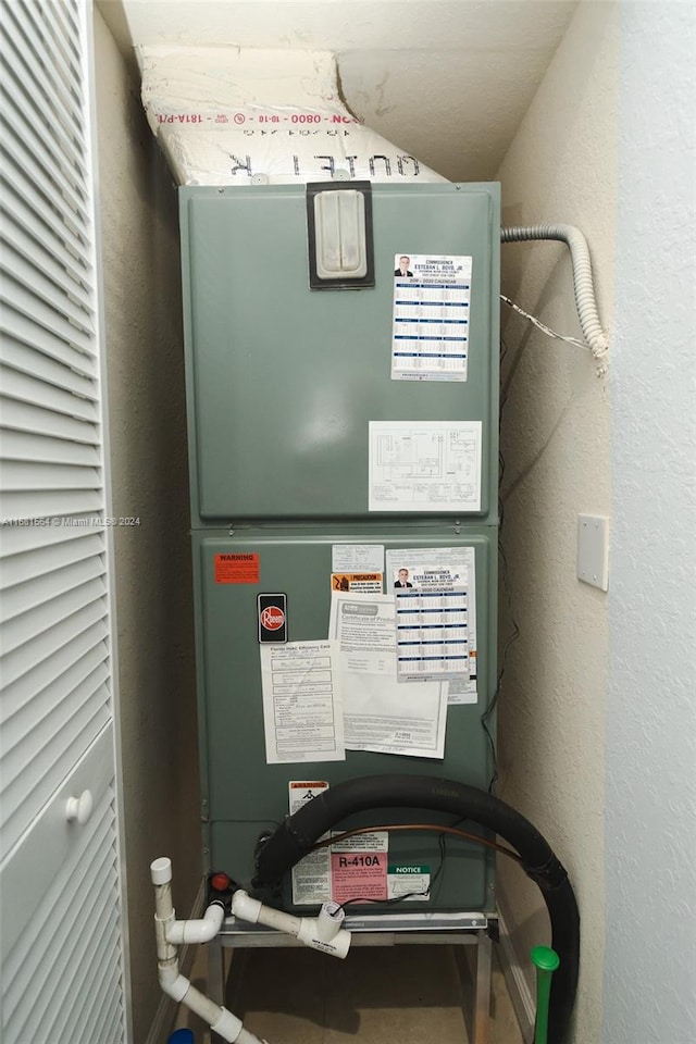 utility room featuring heating unit