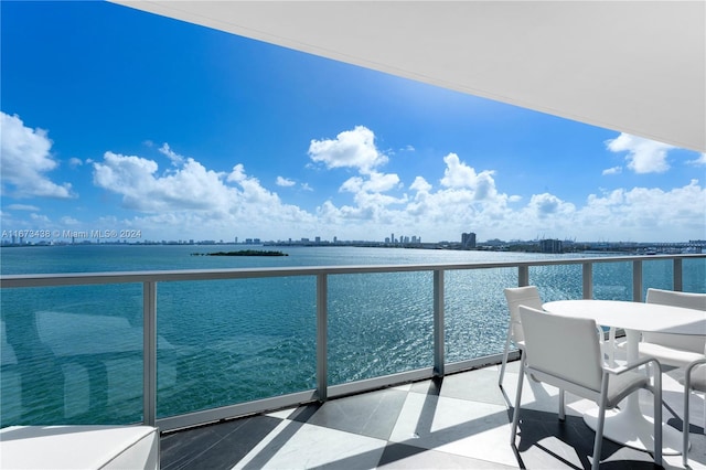 balcony featuring a water view