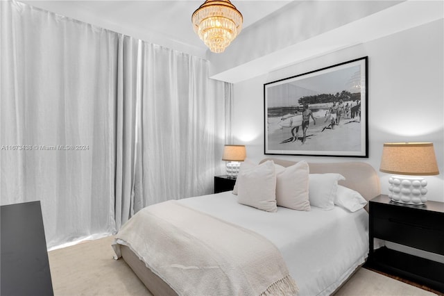 bedroom with a notable chandelier
