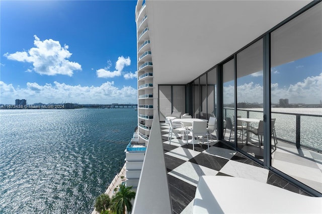 balcony featuring a water view