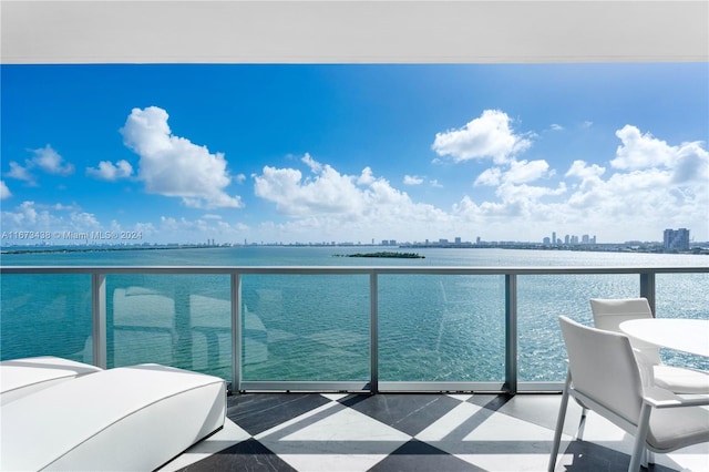 balcony featuring a water view