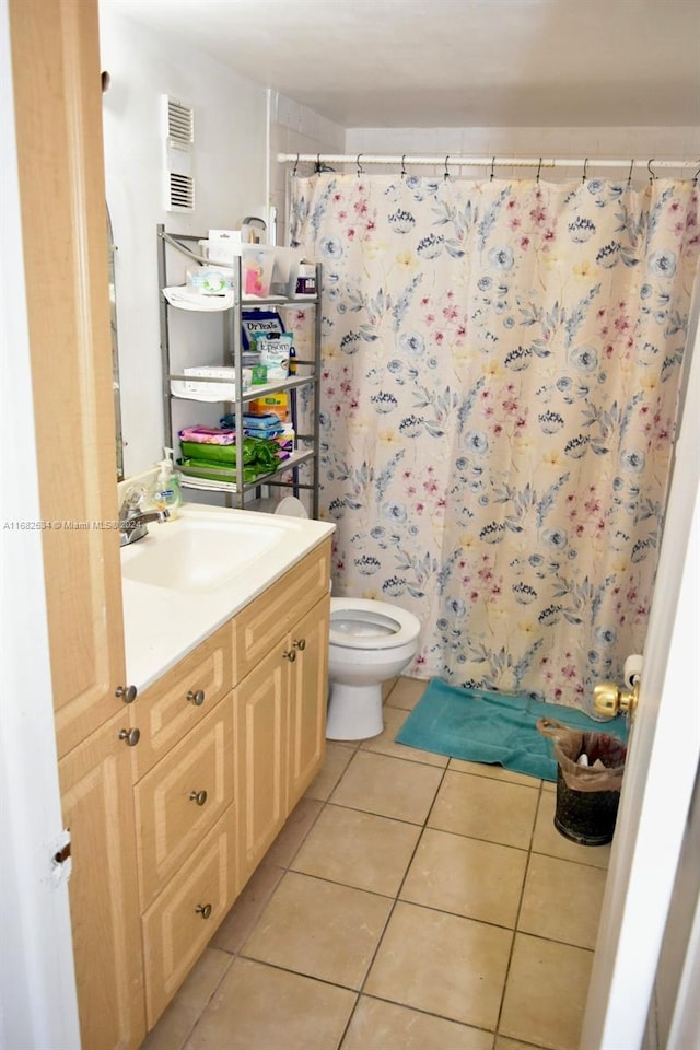 bathroom featuring vanity, toilet, tile patterned floors, and a shower with curtain