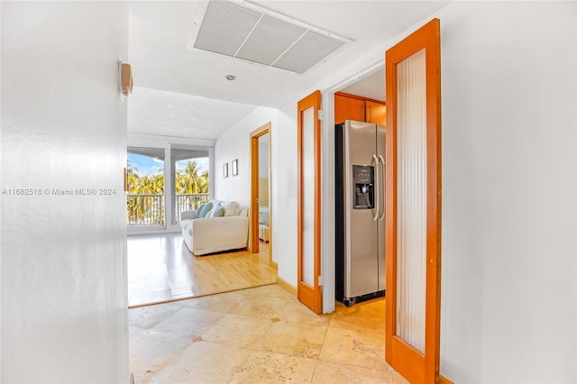 hall with light hardwood / wood-style floors