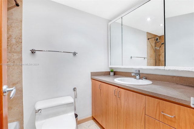 full bathroom with tiled shower / bath, vanity, toilet, and tile patterned floors