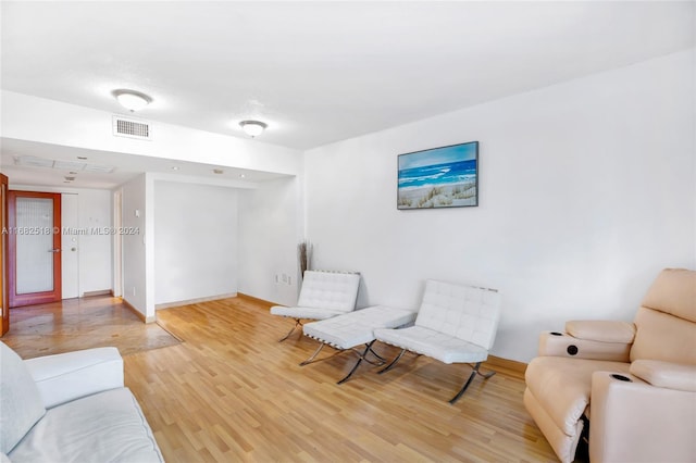 sitting room featuring hardwood / wood-style floors