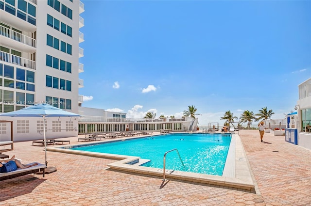 view of swimming pool with a patio area