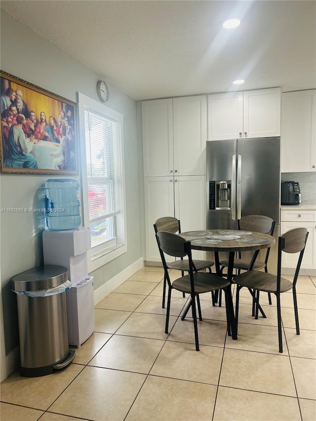 dining area with light tile patterned flooring