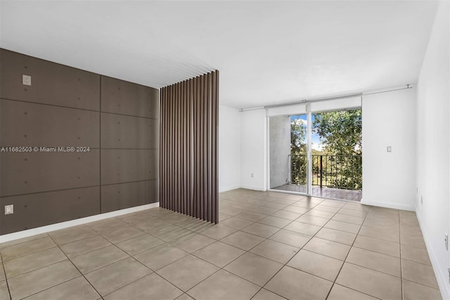 empty room with light tile patterned floors