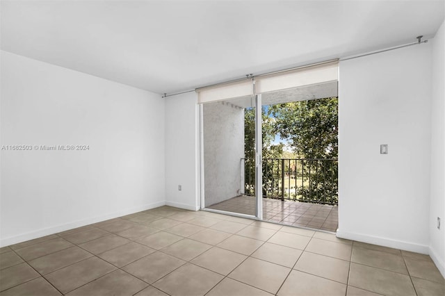 empty room featuring light tile patterned floors