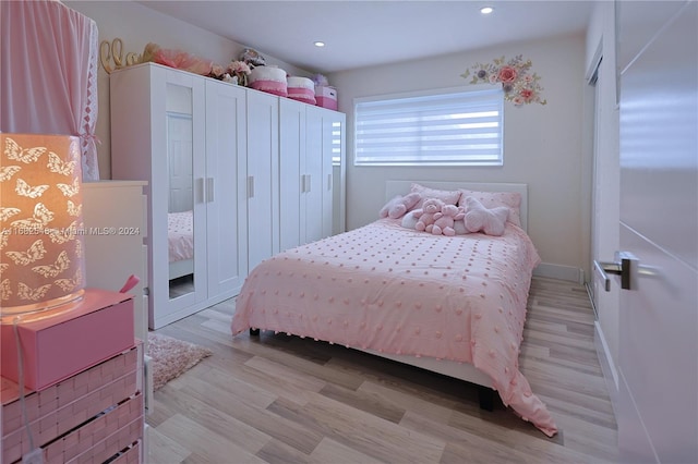 bedroom with light hardwood / wood-style flooring