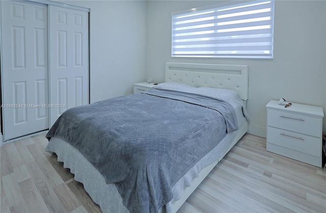 bedroom featuring a closet and light hardwood / wood-style floors