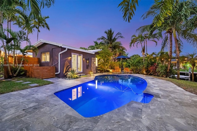 pool featuring a patio and fence