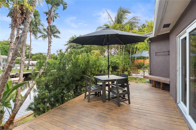 wooden deck with outdoor dining area