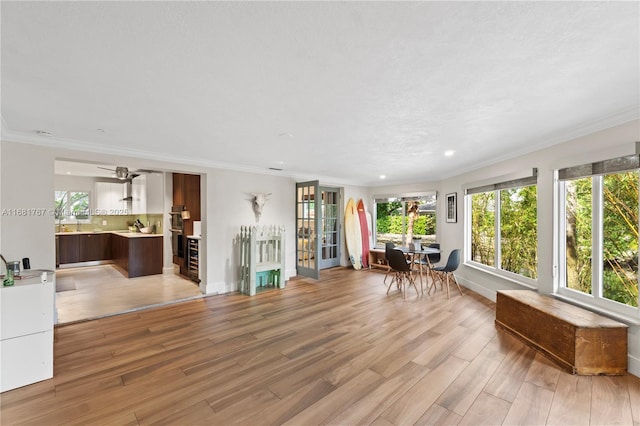 interior space featuring baseboards, recessed lighting, wood finished floors, and crown molding