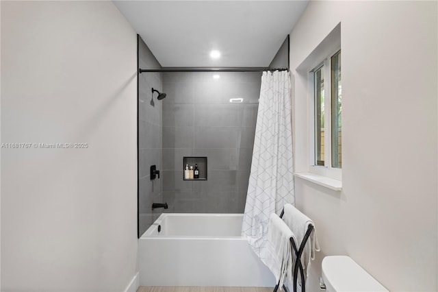 full bath with shower / bath combination with curtain and toilet