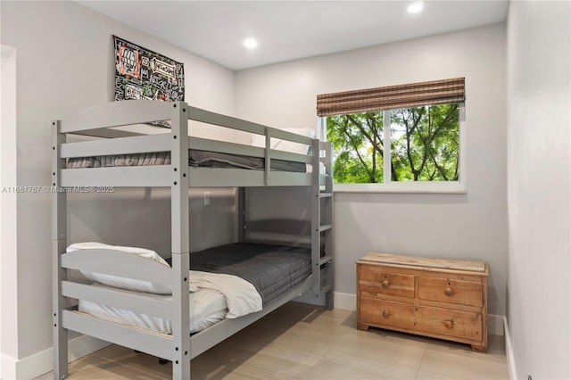 bedroom featuring baseboards and recessed lighting