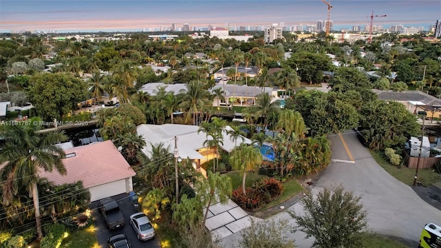 aerial view at dusk featuring a view of city