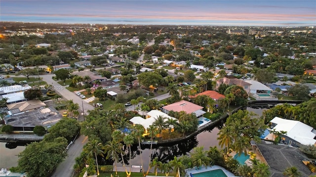 aerial view featuring a residential view and a water view