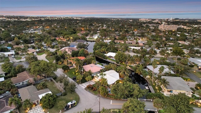 aerial view at dusk featuring a residential view