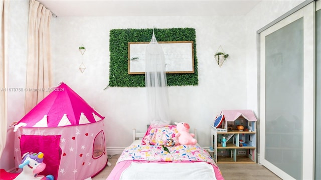 bedroom featuring hardwood / wood-style flooring