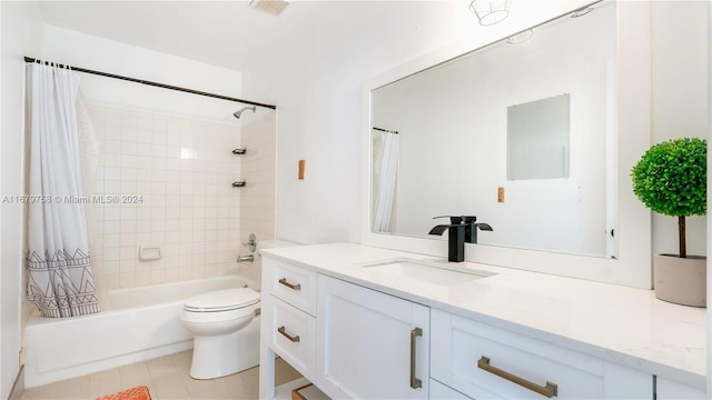 full bathroom featuring tile patterned floors, vanity, shower / bath combination with curtain, and toilet