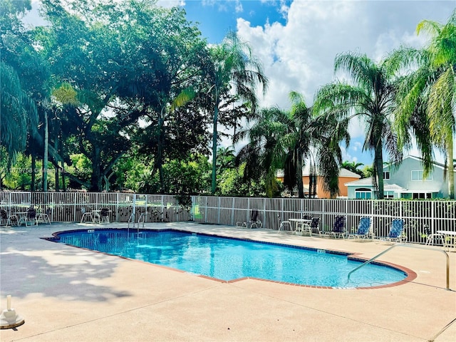 view of swimming pool featuring a patio area