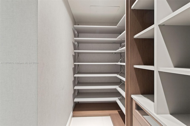 spacious closet featuring light wood-type flooring