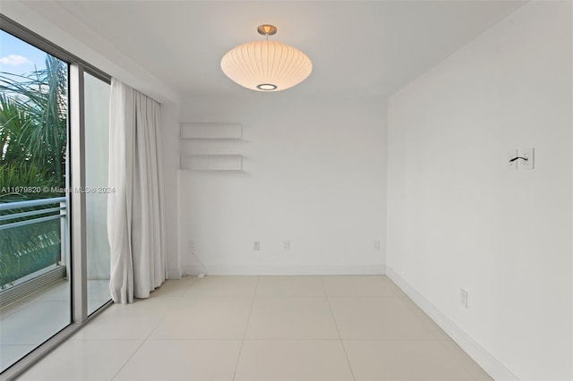 unfurnished room with light tile patterned floors