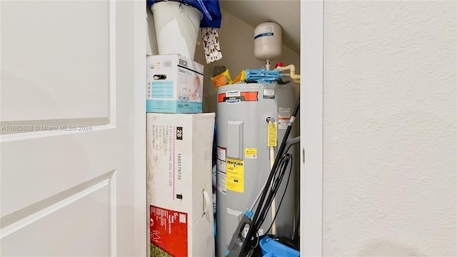 utility room with water heater