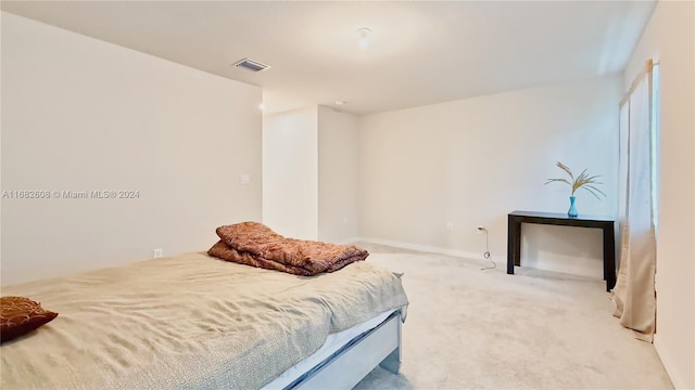 bedroom with light colored carpet