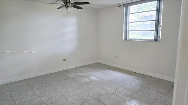 spare room featuring a textured ceiling and ceiling fan