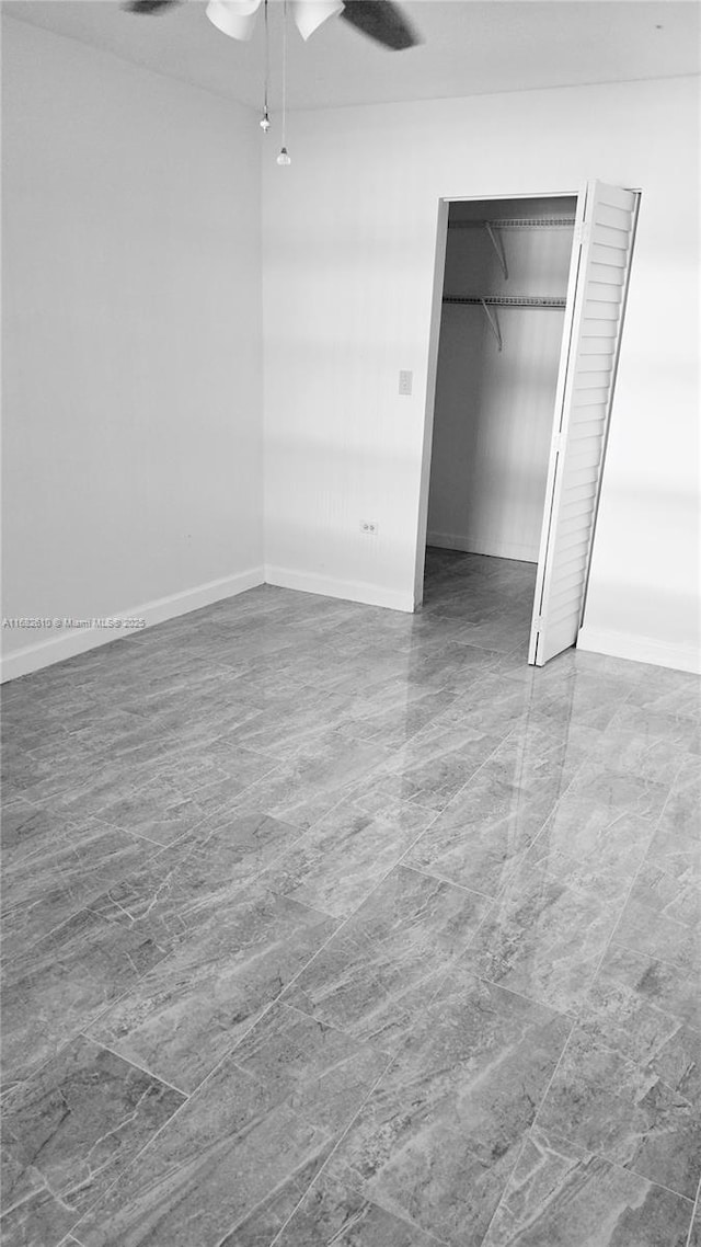 unfurnished bedroom featuring ceiling fan