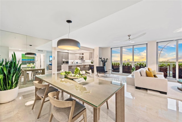 dining space with a ceiling fan, wine cooler, and floor to ceiling windows